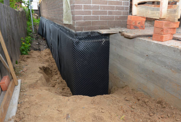 Happy homeowners after waterproofing job in Pataskala